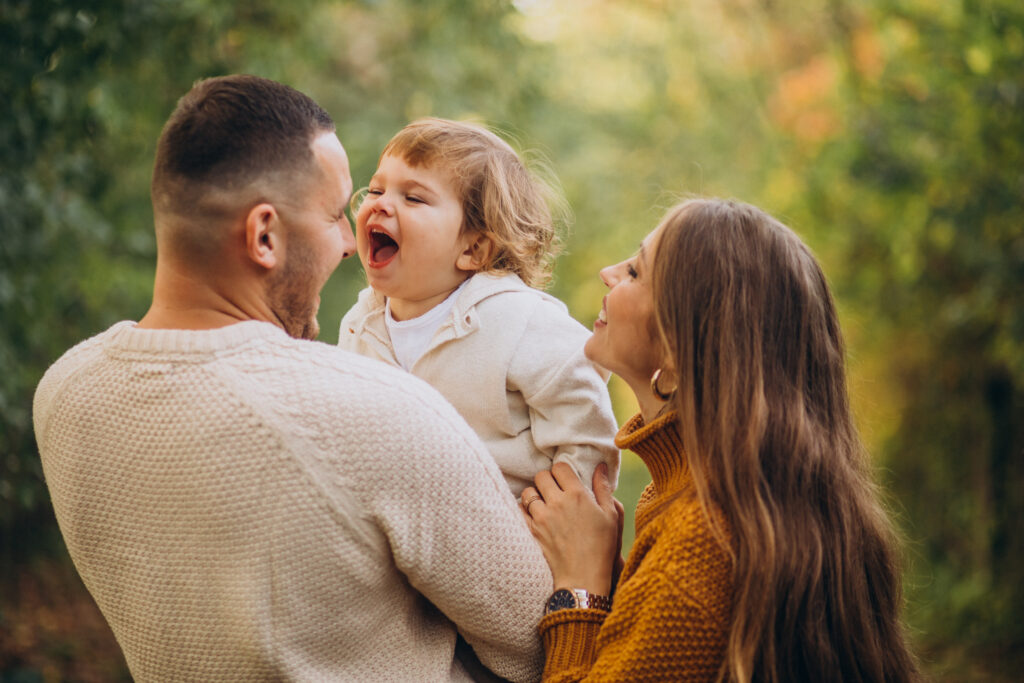 young family with children in autumn park